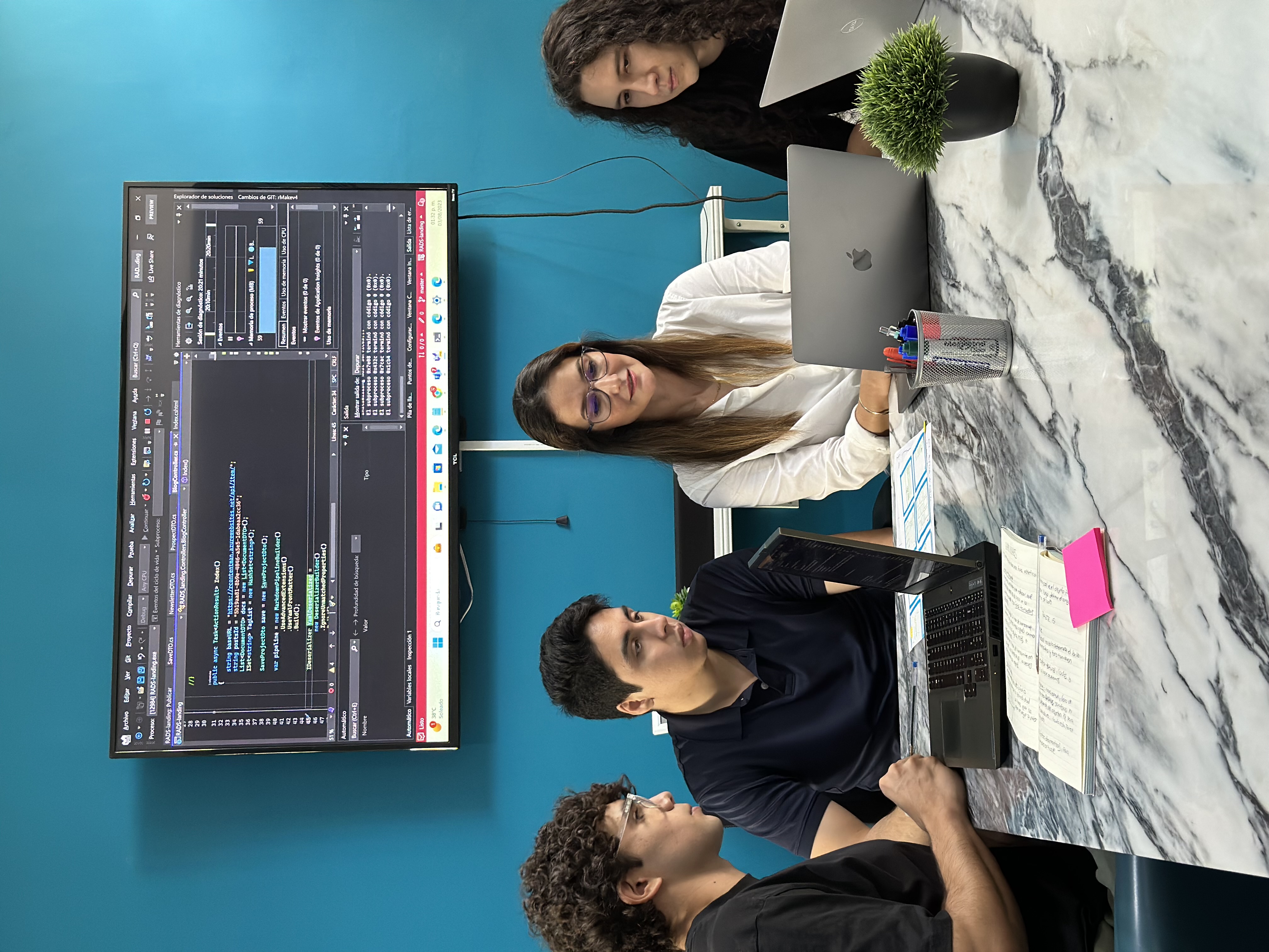 Xilo team reviewing code together